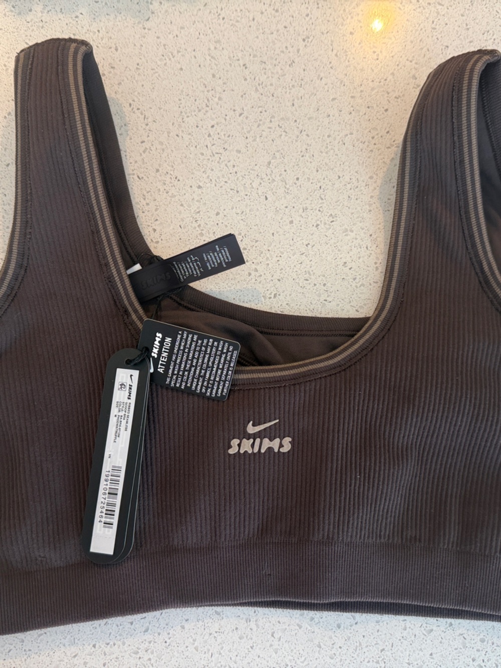 SKIMS Ribbed Sports Bra in Dark Brown with Cream Logo